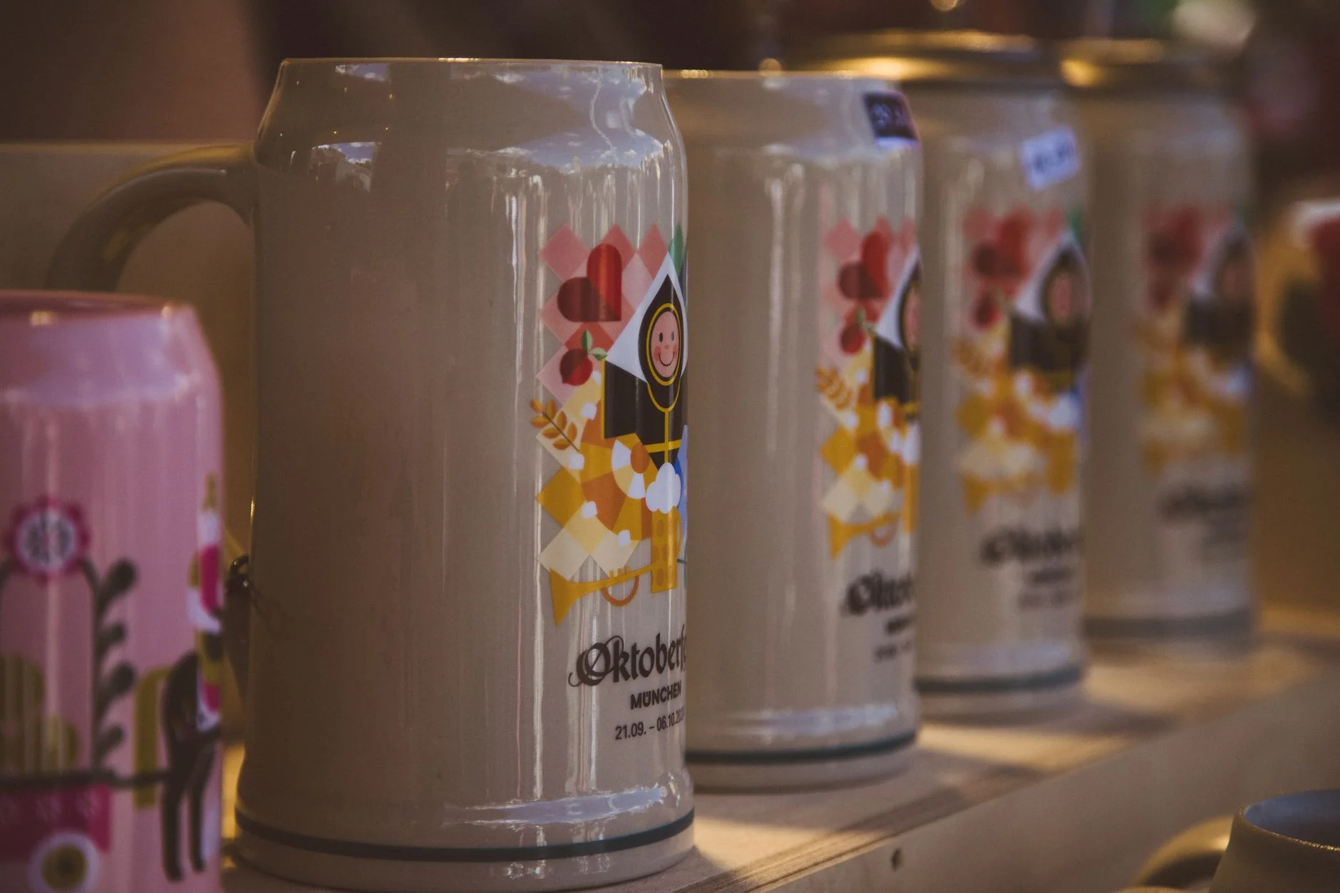 A close-up display of colorful traditional beer steins in Munich