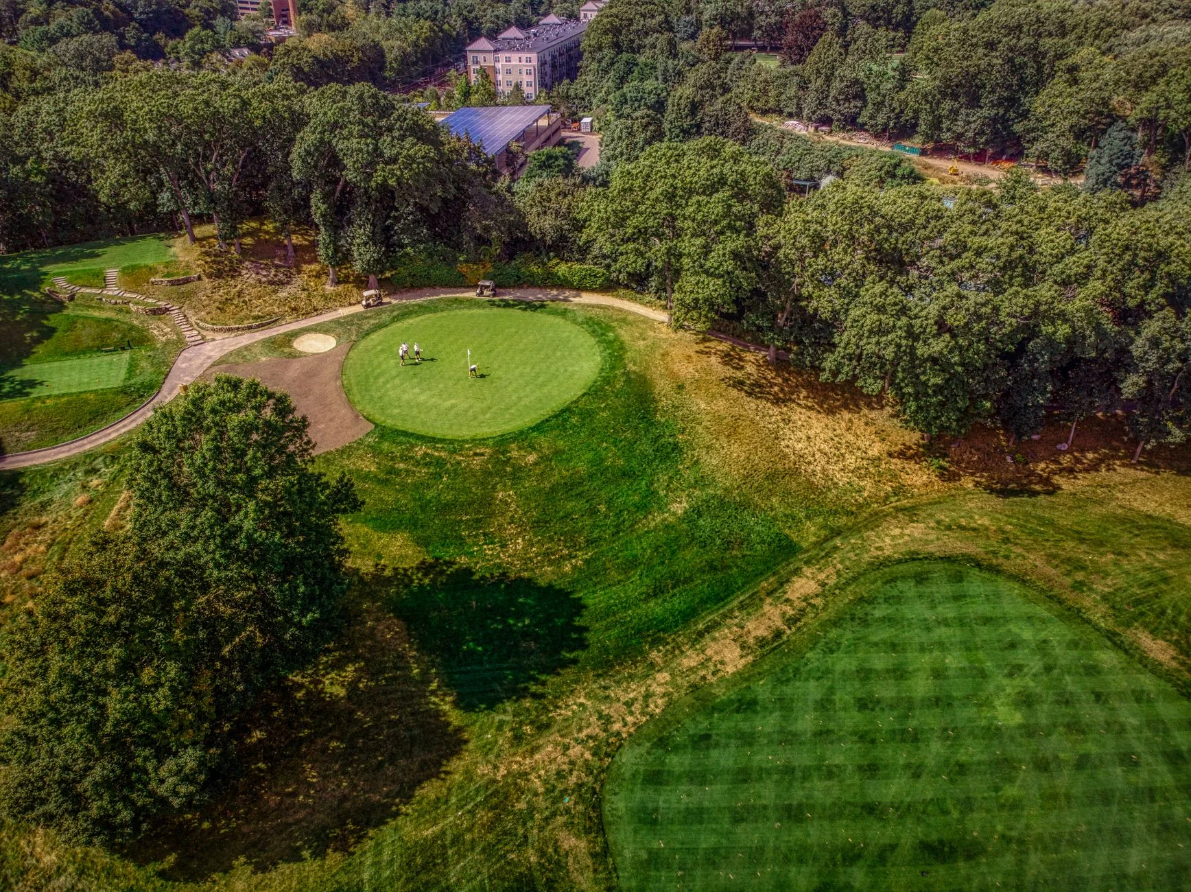 An aerial view of a lush green golf course
