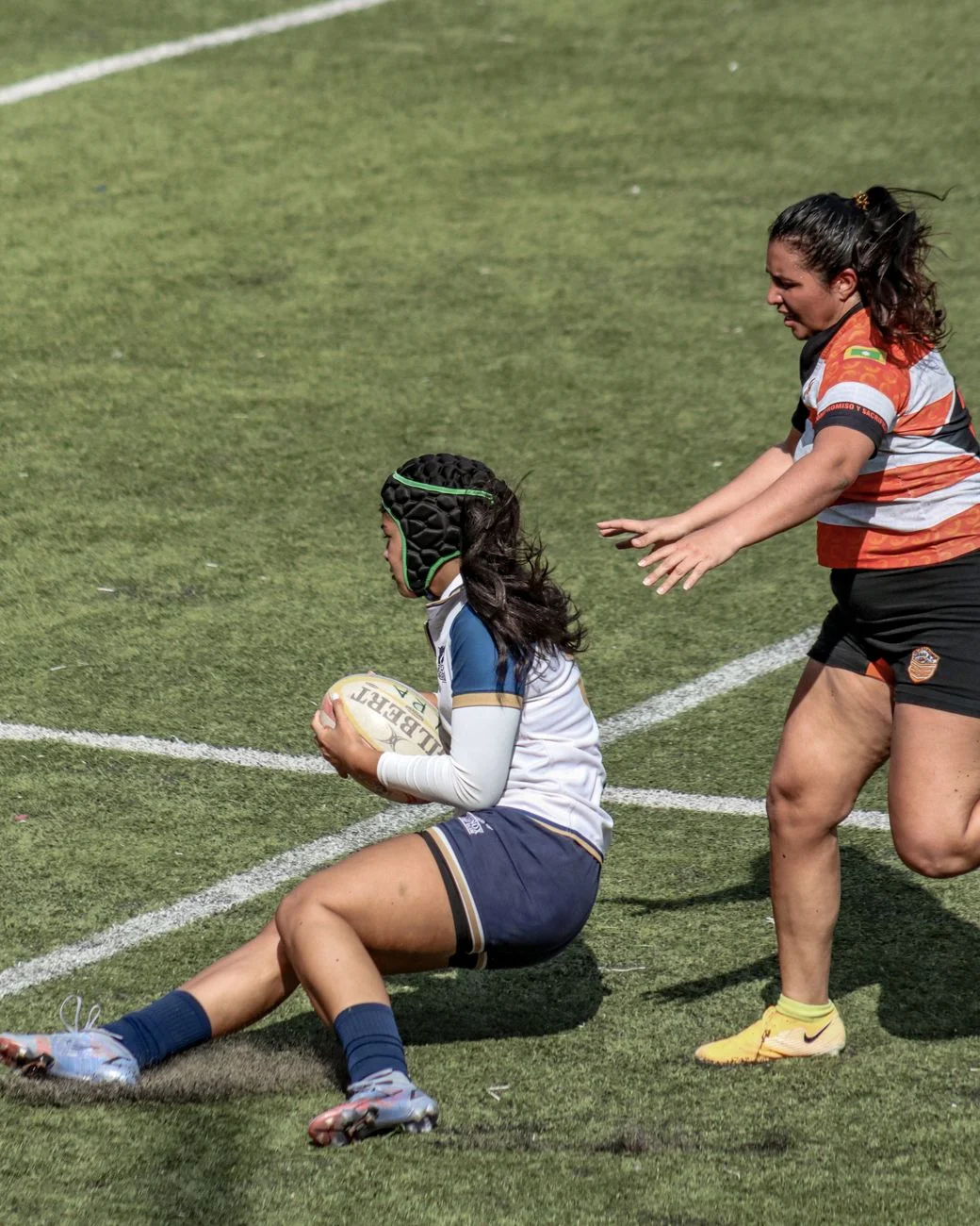 Rugby league action representing the #WomensRLWC hashtag